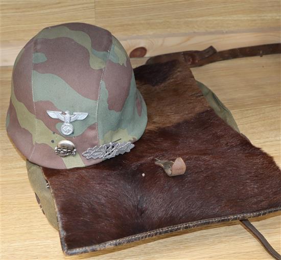 A WWII German ruck-sack helmet, close combat clasp
